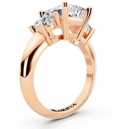 18 KT Rose Gold Radiant Cut Diamond Three Stone Ring with Round Accents - top view