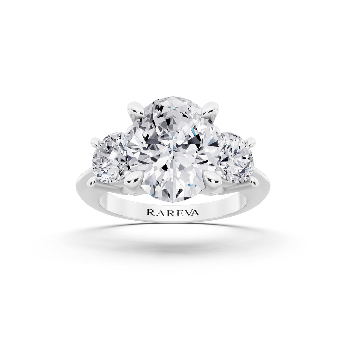 18 KT White Gold Oval Cut Diamond Three Stone Ring with Round Accents - front view