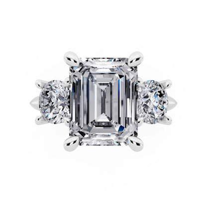 14 KT White Gold Emerald Cut Diamond Three Stone Ring with Round Accents - top angle
