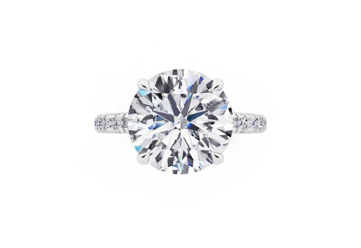 18 KT White Gold Round Cut Diamond Solitaire Ring with Hidden Halo and French Pave Band - top angle