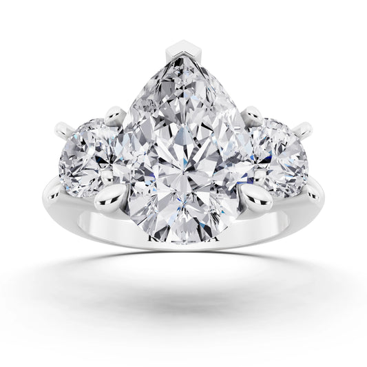 Platinum Pear Cut Diamond Three Stone Ring with Round Accents - front view
