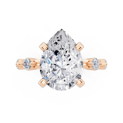 14 KT Rose Gold Pear Cut Diamond Solitaire Ring with Floating Diamond Accents - top angle