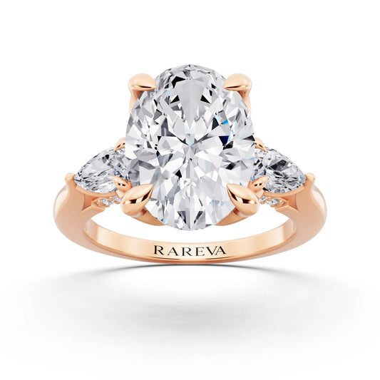 18 KT Rose Gold Oval Cut Diamond Cluster Engagement Ring with Pear Accents and Pavé Band - front view