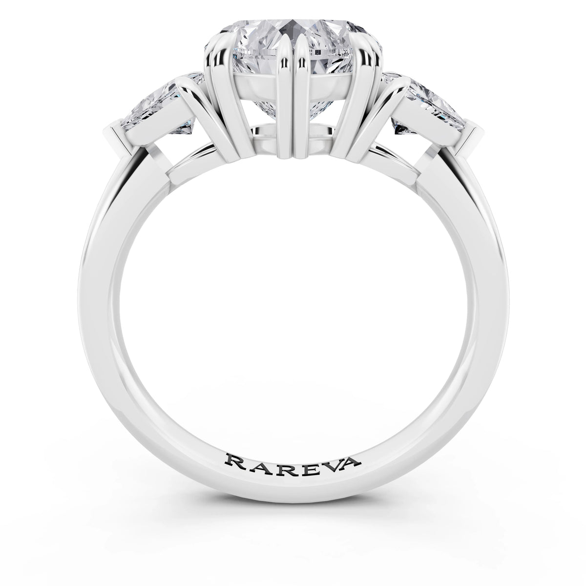 18 KT White Gold Heart Cut Diamond Three Stone Ring with Trillion Accents - through finger