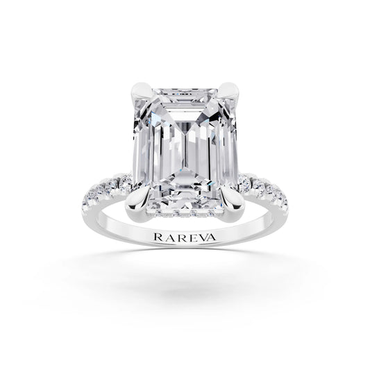 18 KT White Gold Emerald Cut Diamond Solitaire Ring with Round Pavé Band and Prong Setting - front view