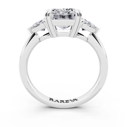 18 KT White Gold Emerald Cut Diamond Three Stone Ring with Trillion Accents - through finger