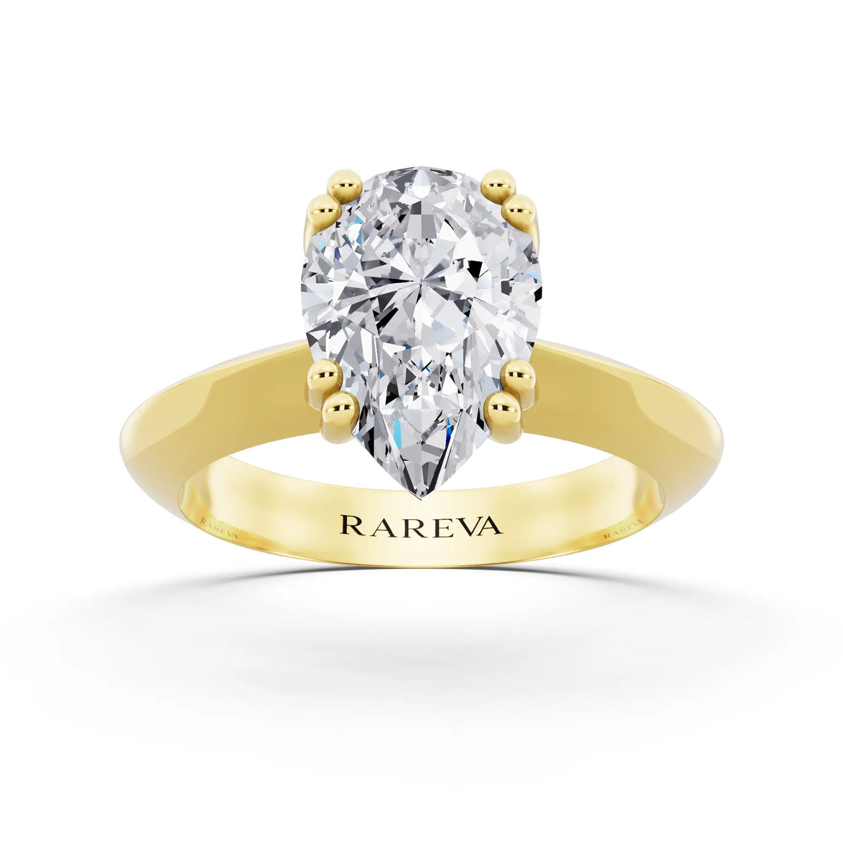 18 KT Yellow Gold Pear Cut Diamond Solitaire Ring with Knife Edge Band - front view