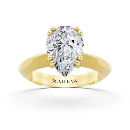 18 KT Yellow Gold Pear Cut Diamond Solitaire Ring with Knife Edge Band - front view