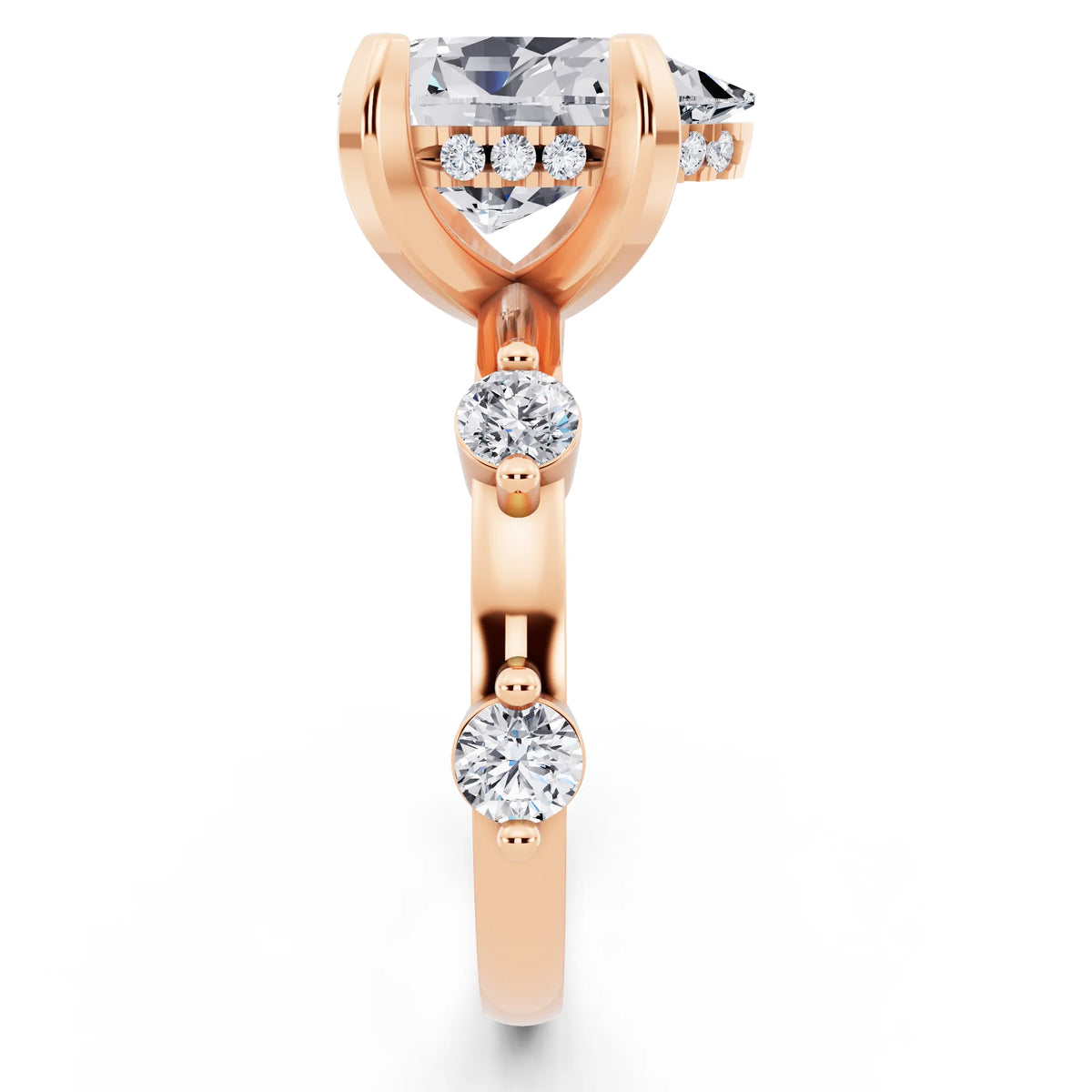 14 KT Rose Gold Pear Cut Diamond Solitaire Ring with Floating Diamond Accents - side view