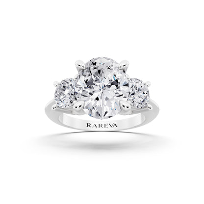 Platinum Oval Cut Diamond Three Stone Ring with Round Accents - front view