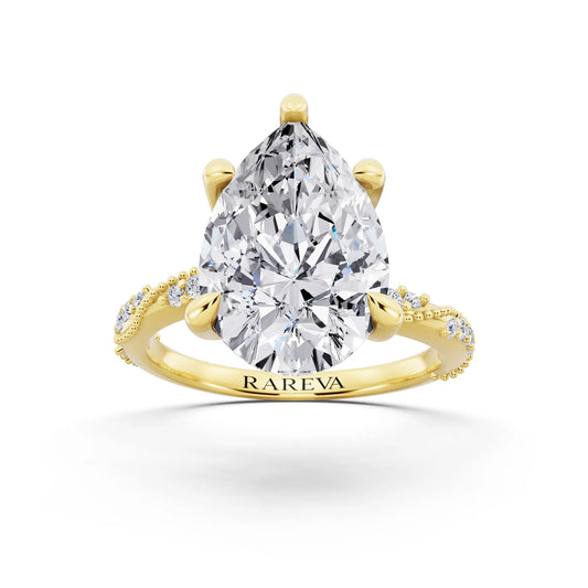 18 KT Yellow Gold Pear Cut Diamond Ring with Marquise Accent - front view