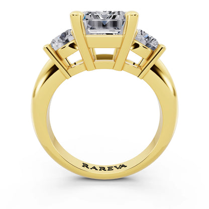 18 KT Yellow Gold Emerald Cut Diamond Three Stone Ring with Round Accents - through finger