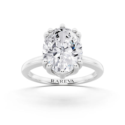 18 KT White Gold Oval Cut Diamond Solitaire Ring with Hidden Accent Basket - front view
