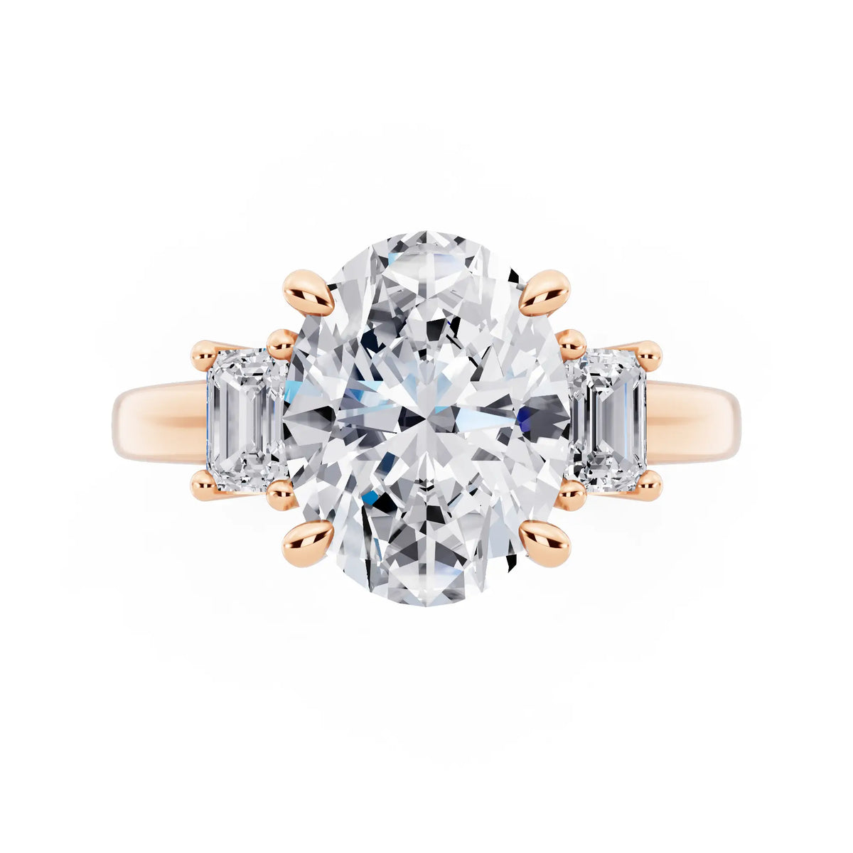 18 KT Rose Gold Oval Cut Diamond Three Stone Emerald Accent Ring - top angle