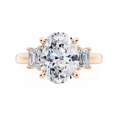 18 KT Rose Gold Oval Cut Diamond Three Stone Emerald Accent Ring - top angle
