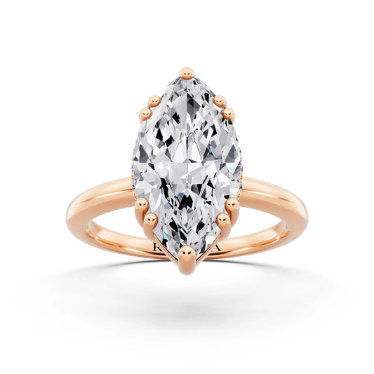 14 KT Rose Gold Marquise Cut Diamond Solitaire Ring with Hidden Accent Basket - front view