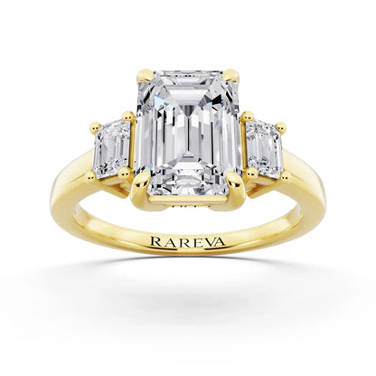 14 KT Yellow Gold Emerald Cut Diamond Three Stone Emerald Accent Ring - front view