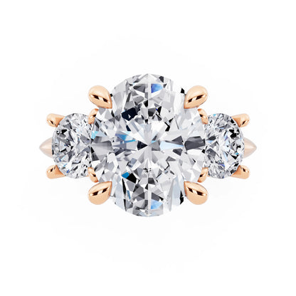 18 KT Rose Gold Oval Cut Diamond Three Stone Ring with Round Accents - top angle