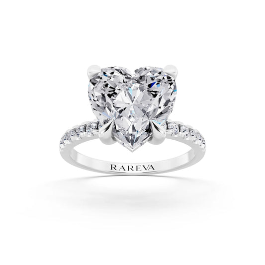 18 KT White Gold Heart Cut Diamond Solitaire Ring with Round Pavé Band and Prong Setting - front view