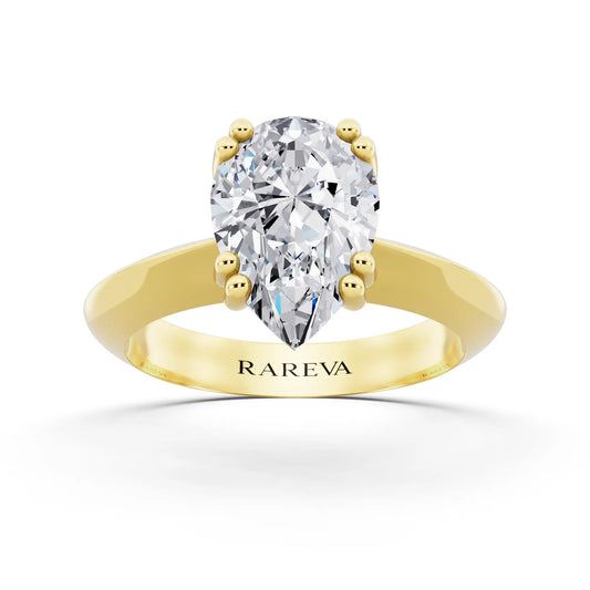14 KT Yellow Gold Pear Cut Diamond Solitaire Ring with Knife Edge Band - front view