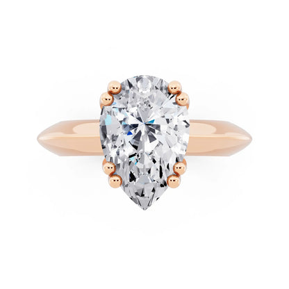 18 KT Rose Gold Pear Cut Diamond Solitaire Ring with Knife Edge Band - top angle