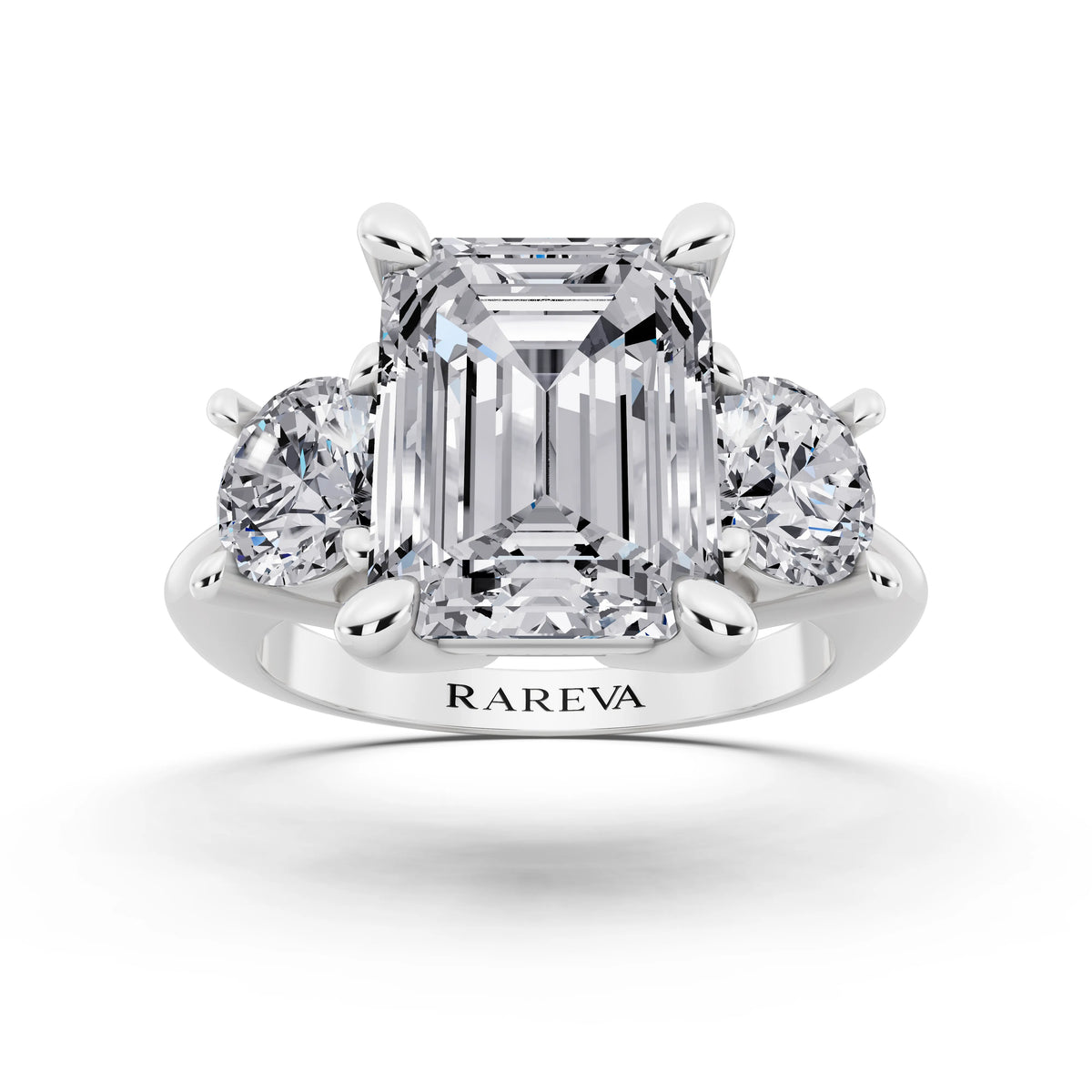 18 KT White Gold Emerald Cut Diamond Three Stone Ring with Round Accents - front view