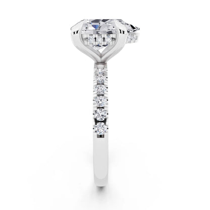 Platinum Pear Cut Diamond Solitaire Ring with Round Pavé Band and Prong Setting - side view