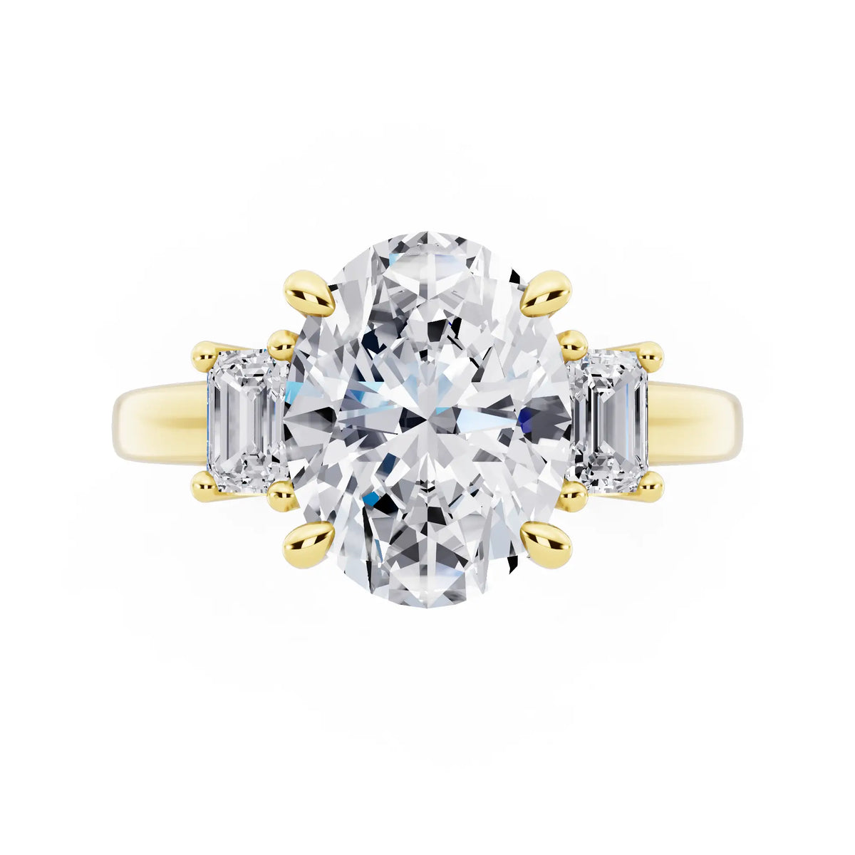 18 KT Yellow Gold Oval Cut Diamond Three Stone Emerald Accent Ring - top angle