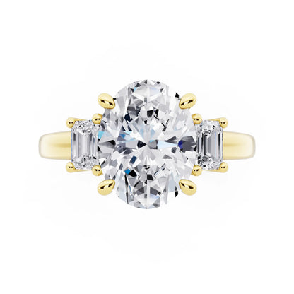 18 KT Yellow Gold Oval Cut Diamond Three Stone Emerald Accent Ring - top angle