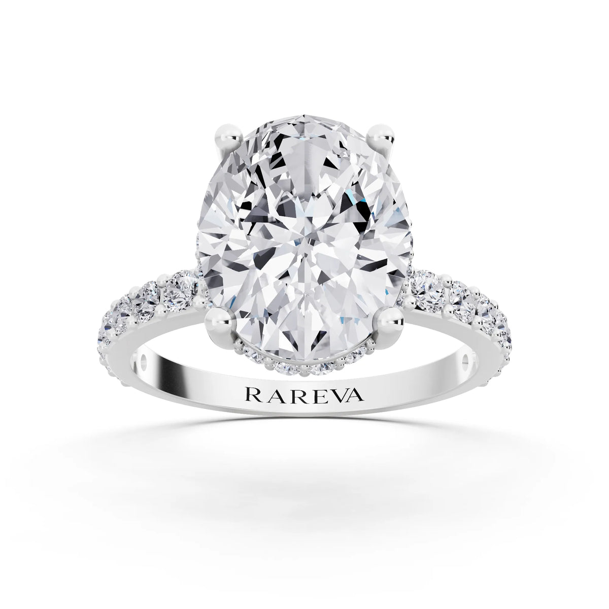 18 KT White Gold Oval Cut Diamond Solitaire Ring with Hidden Halo and Pave Band - front view