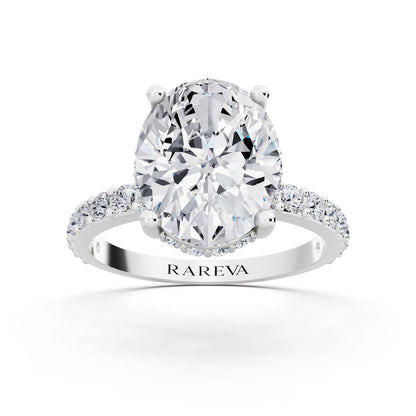 18 KT White Gold Oval Cut Diamond Solitaire Ring with Hidden Halo and Pave Band - front view