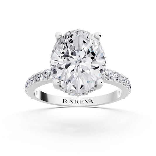 18 KT White Gold Oval Cut Diamond Solitaire Ring with Hidden Halo and Pave Band - front view