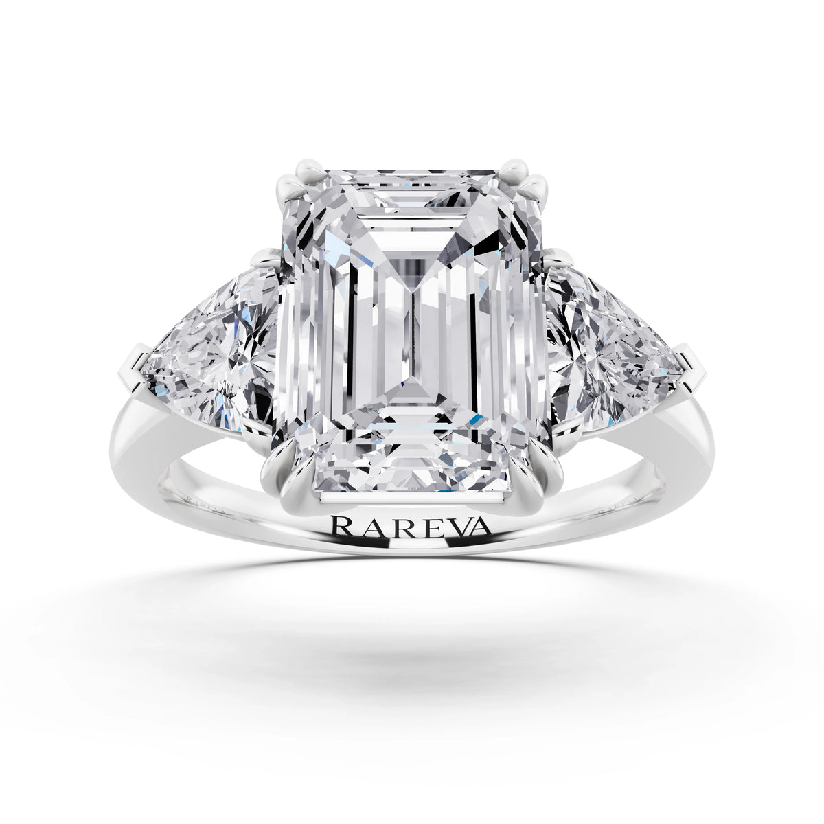 18 KT White Gold Emerald Cut Diamond Three Stone Ring with Trillion Accents - front view