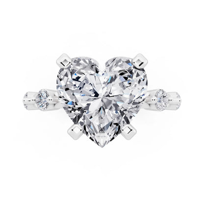 Platinum Heart Cut Diamond Solitaire Ring with Floating Diamond Accents - top angle