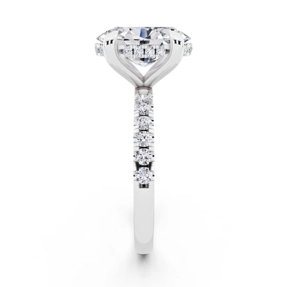 18 KT White Gold Oval Cut Diamond Solitaire Ring with Round Pavé Band and Prong Setting - side view