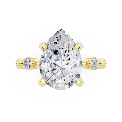 18 KT Yellow Gold Pear Cut Diamond Solitaire Ring with Floating Diamond Accents - top angle