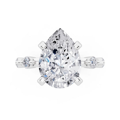 Platinum Pear Cut Diamond Solitaire Ring with Floating Diamond Accents - top angle