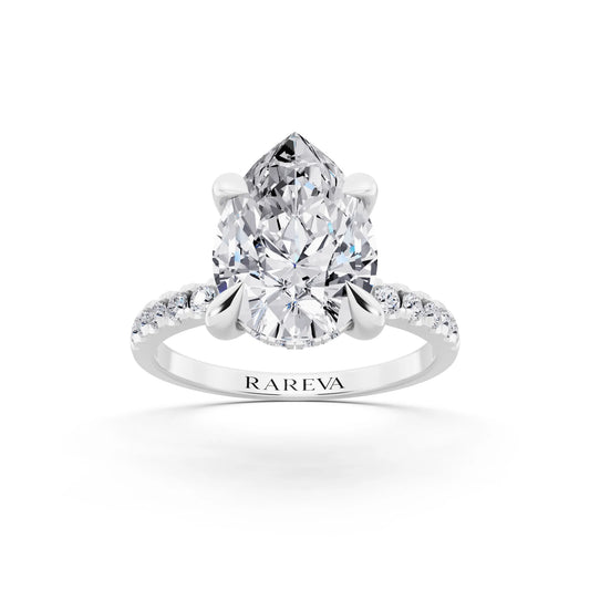 14 KT White Gold Pear Cut Diamond Solitaire Ring with Round Pavé Band and Prong Setting - front view