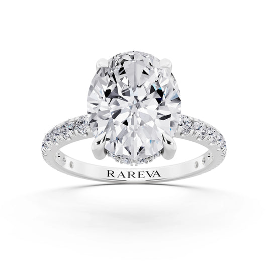 14 KT White Gold Oval Cut Diamond Solitaire Ring with Hidden Halo and French Pave Band - front view