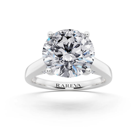 Platinum Round Cut Diamond Solitaire Ring with Hidden Accent - front view