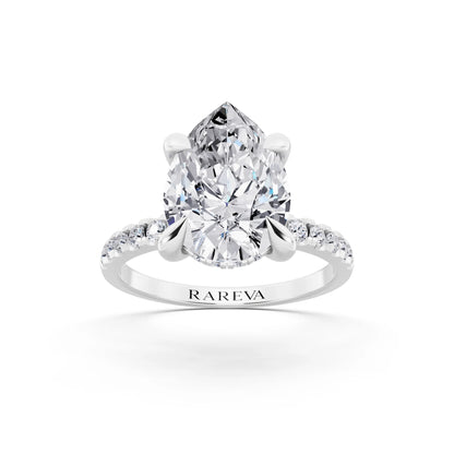 Platinum Pear Cut Diamond Solitaire Ring with Round Pavé Band and Prong Setting - front view
