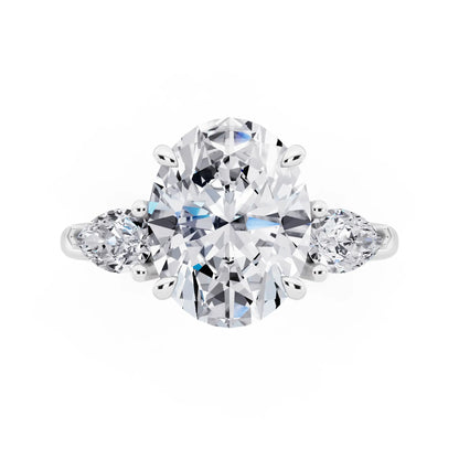 Platinum Oval Cut Diamond Three Stone Pear Accent Ring - top angle