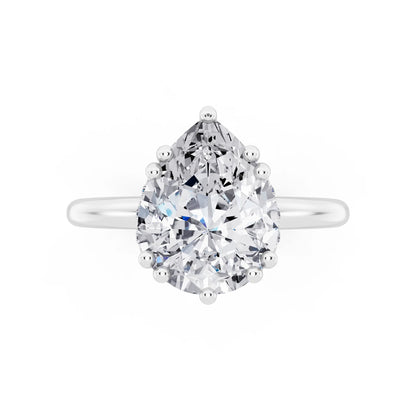 Platinum Pear Cut Diamond Solitaire Ring with Hidden Accent Basket - top angle