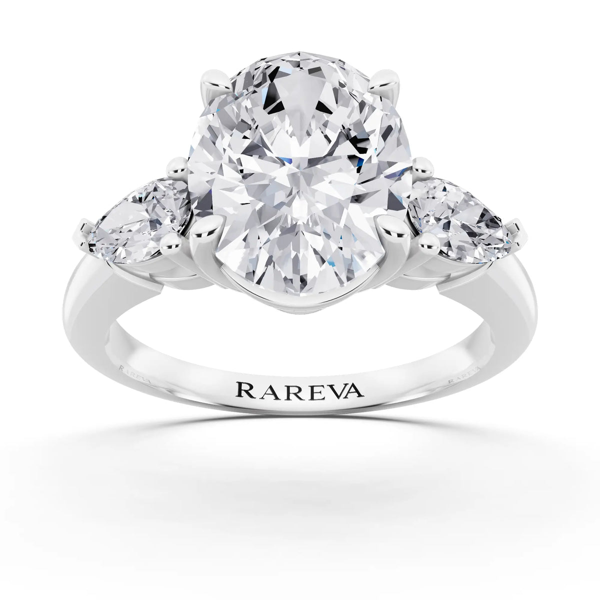 Platinum Oval Cut Diamond Three Stone Pear Accent Ring - front view