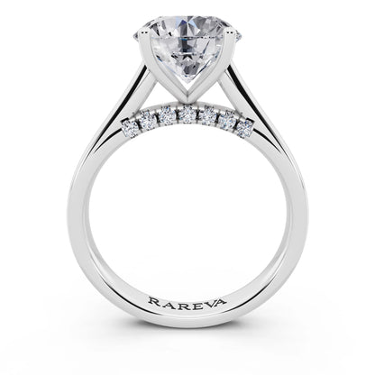 Platinum Round Cut Diamond Solitaire Ring with Hidden Accent - through finger
