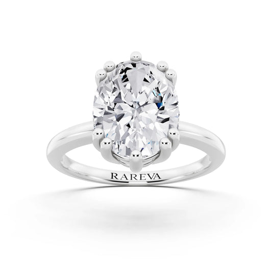 Platinum Oval Cut Diamond Solitaire Ring with Hidden Accent Basket - front view