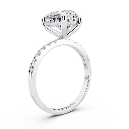 Platinum Heart Cut Diamond Solitaire Ring with Round Pavé Band and Prong Setting - top view