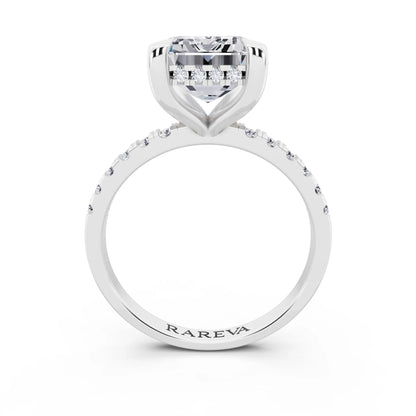 Platinum Emerald Cut Diamond Solitaire Ring with Round Pavé Band and Prong Setting - through finger