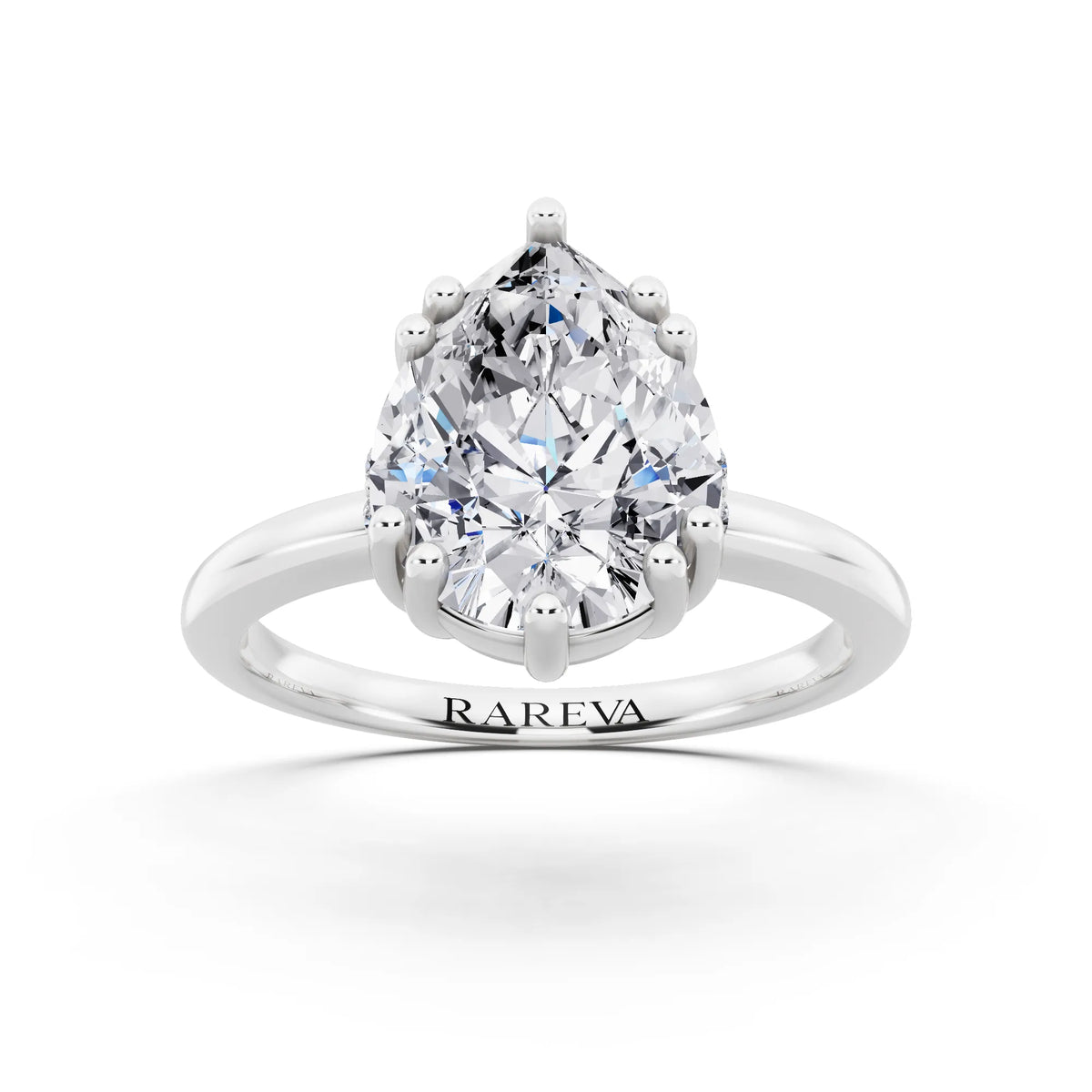 18 KT White Gold Pear Cut Diamond Solitaire Ring with Hidden Accent Basket - front view