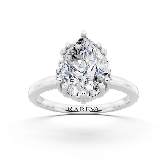 18 KT White Gold Pear Cut Diamond Solitaire Ring with Hidden Accent Basket - front view